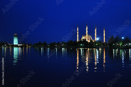 The view mosque and reflection at night, city background. © Seda Servet