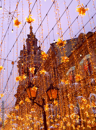 Christmas illumination (decoration) in Moscow on Nikolskaya street. Yellow stars, garlands. Holiday ( New Year) in the city © elens19