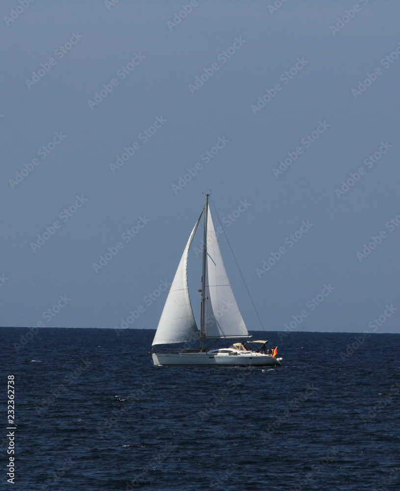 Sailboat on the blue sea