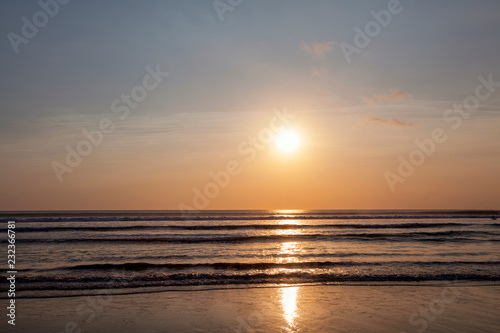 Fototapeta Naklejka Na Ścianę i Meble -  Beautiful sunrise over the tropical beach