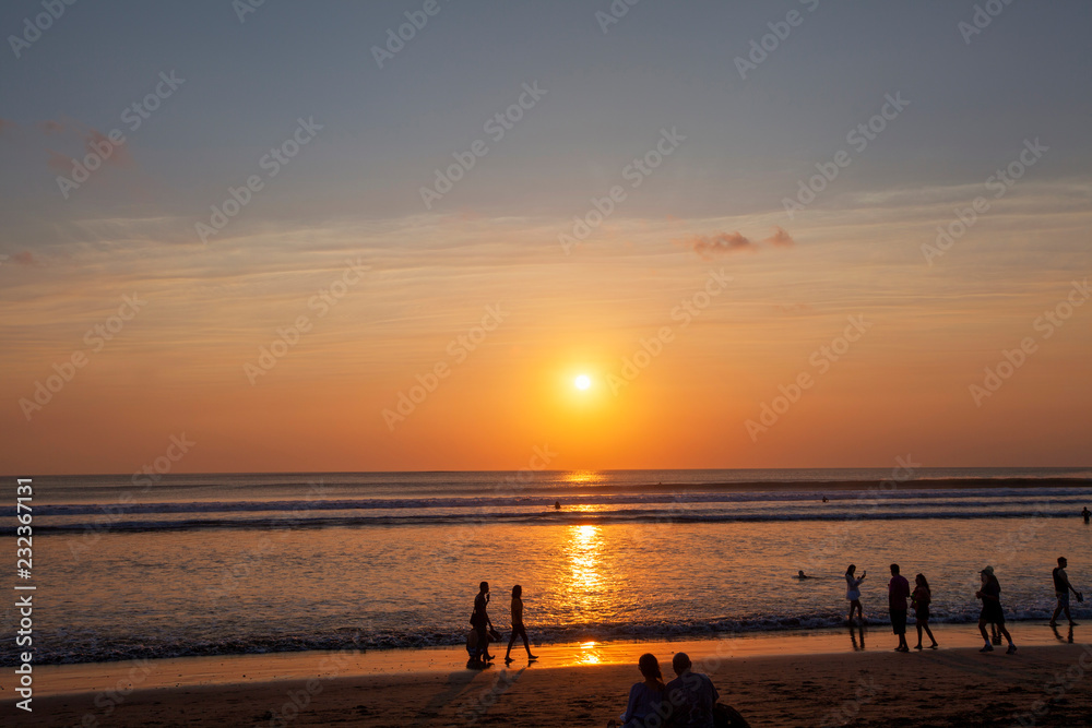 People enjoy sunset at Seminyak (Kuta) Bali - Indonesia People enjoy sunset at Seminyak (Kuta) Bali - Indonesia