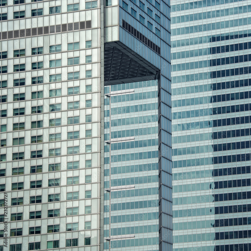 Skyscraper. Modern architectural building. Glass and concrete. Urban landscape. City Business District. High-rise buildings. Close up Skyscraper. Modern architectural building. Glass and concrete. Urban landscape. City Business District. High-rise buildings. Close up