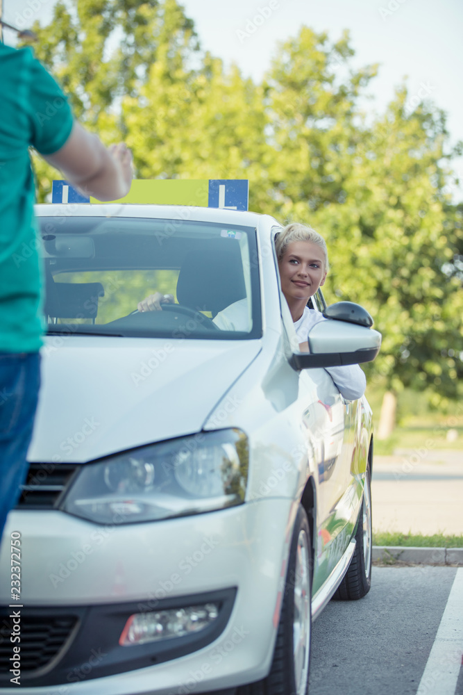 Learner driver girl with instructor Learner driver girl with instructor