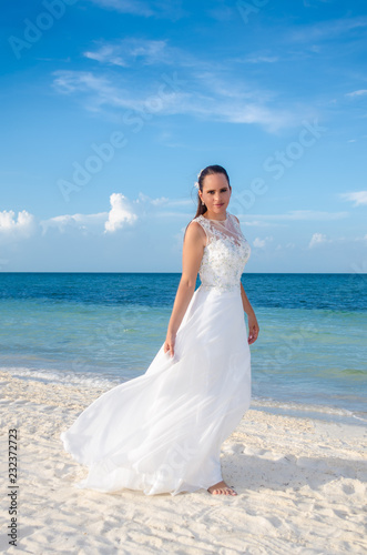 Beautiful mature bride in a tropical beach