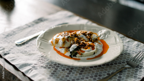 Ravioli with yogurt, paste, walnut and paste