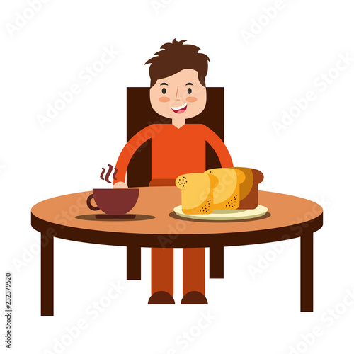 boy eating breakfast in the table