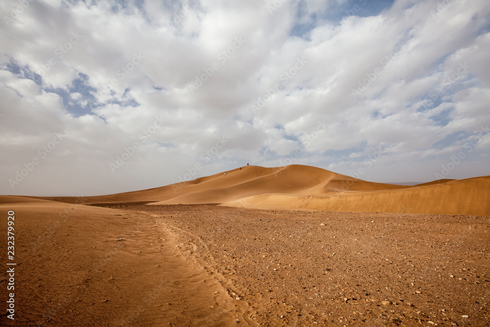Moroccan desert landscape with blue sky. Dunes background
