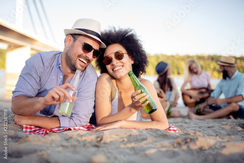Romantic couple drinking beer
