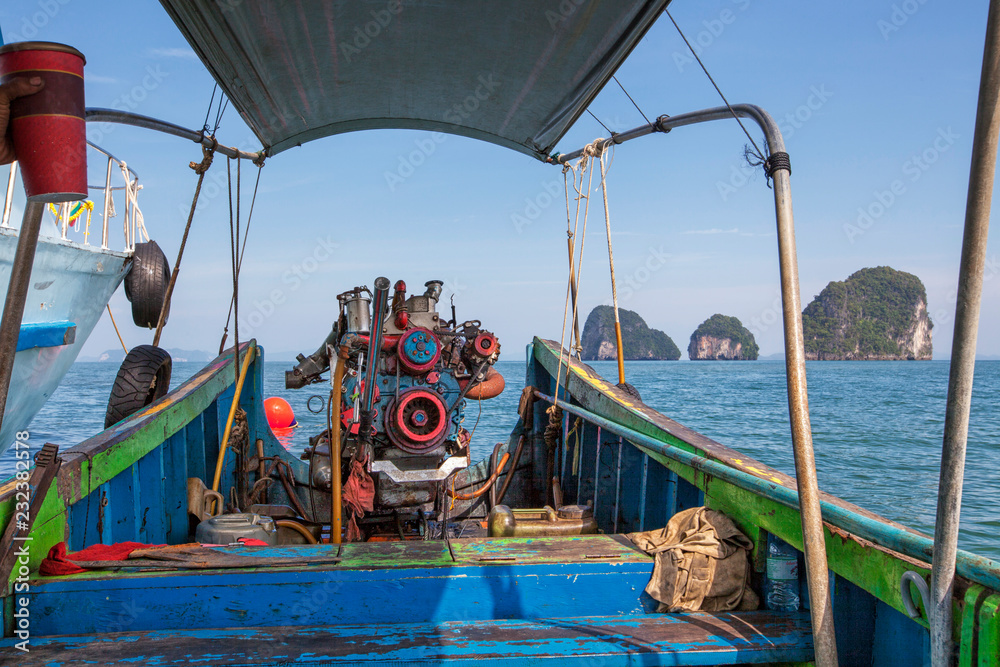 Old Machine of Fishing boat at the sea in Thailand