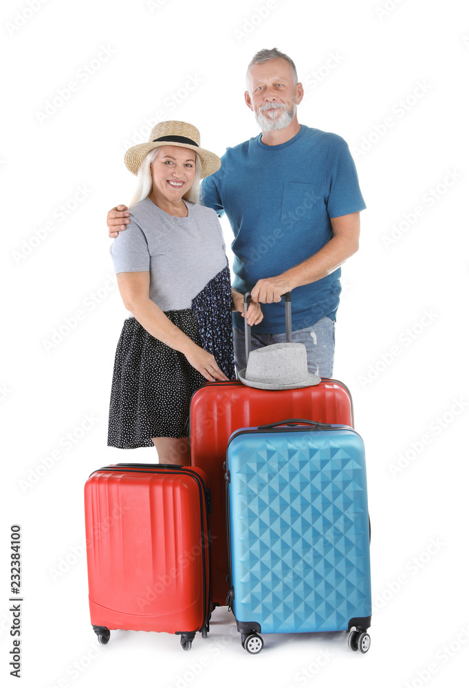 Senior couple with suitcases on white background. Vacation travel Senior couple with suitcases on white background. Vacation travel
