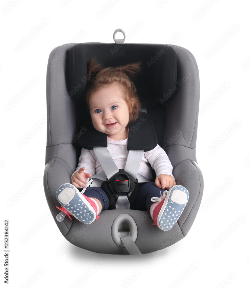 © New Africa - Adorable baby girl in child car safety seat on white background