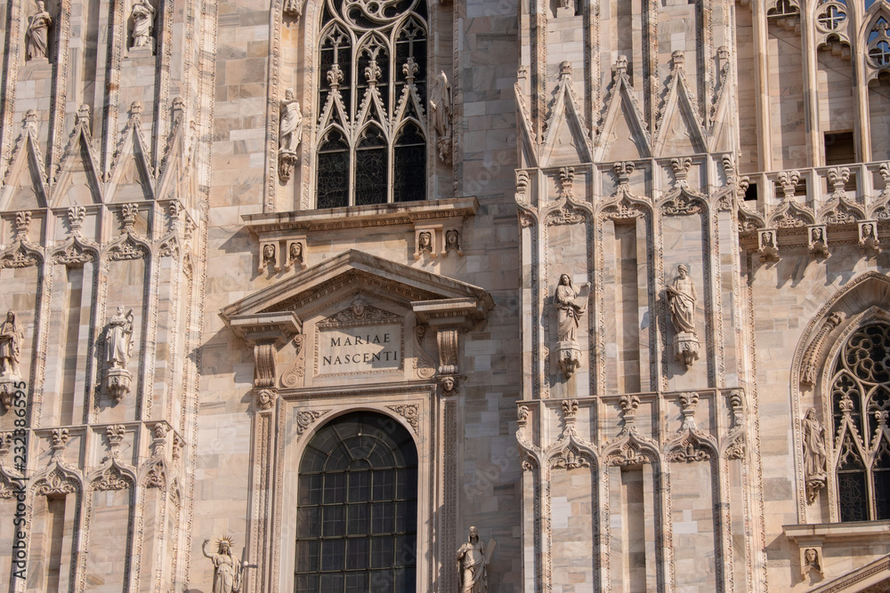 the writing Marie nascenti on the front of the Duomo cathedral of Milan