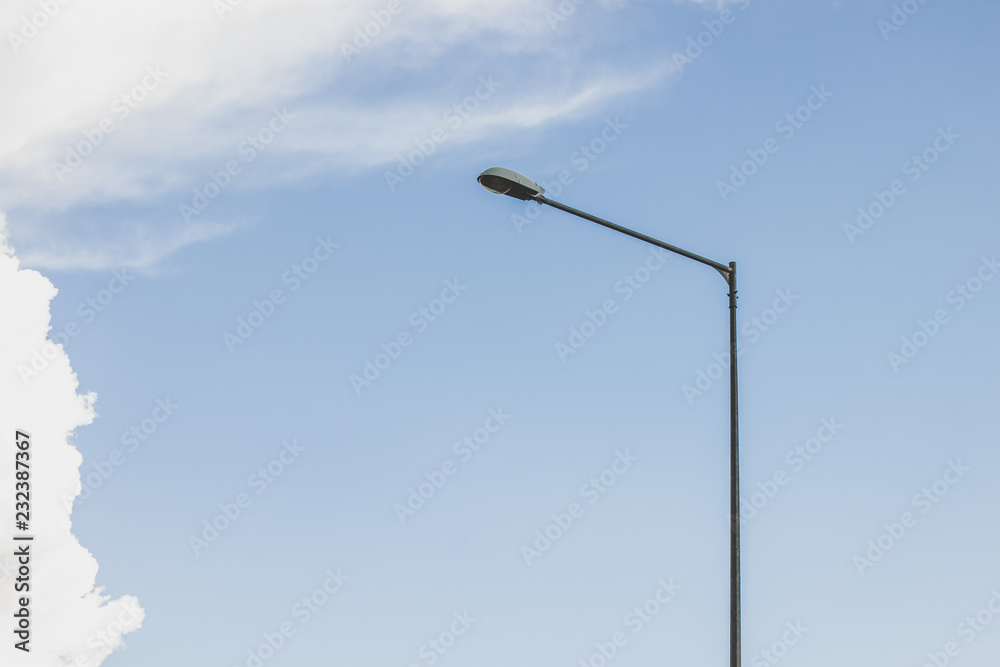 street high lantern near highway road on blue sky with clouds background and empty copy space street high lantern near highway road on blue sky with clouds background and empty copy space