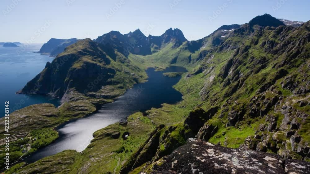 Lake Agvatnet, the village of A i Lofoten and the Norwegian sea, Lofoten archipelago, Norway.