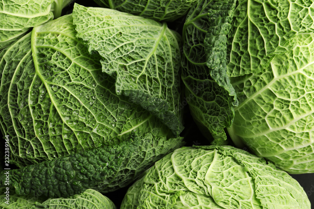 Fototapeta premium Fresh green savoy cabbages as background, top view