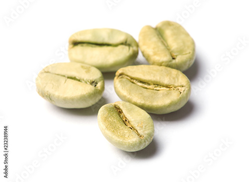 Green coffee beans on white background, closeup