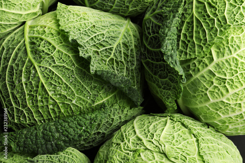 Fresh green savoy cabbages as background, top view