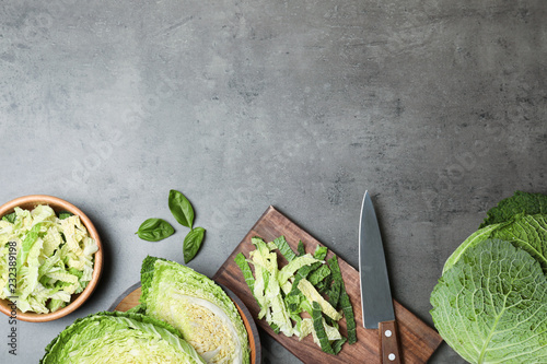 Flat lay composition with savoy cabbage and space for text on grey background