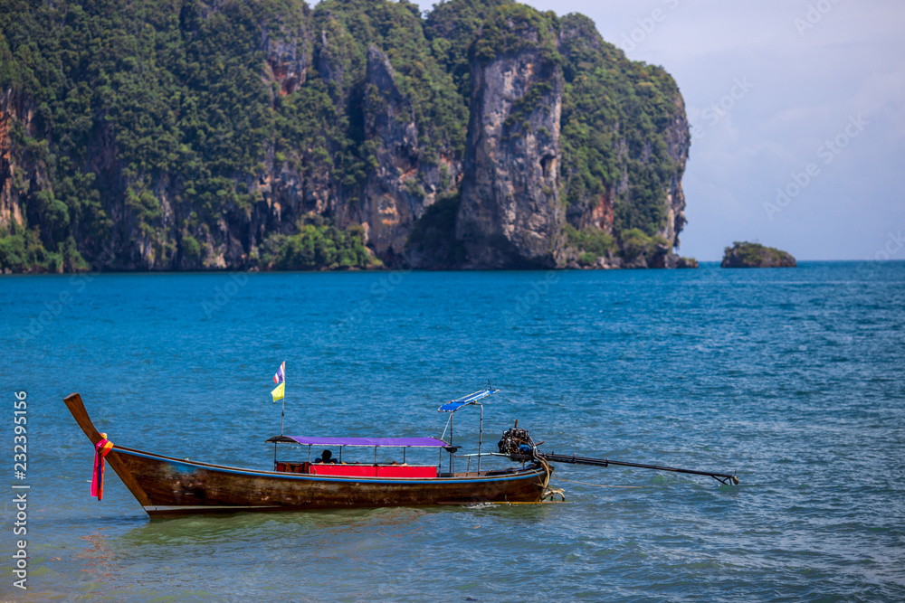 Noppharat Thara Beach- Krabi, the background of the fishing boats of the villagers docked in the midst of the blue sea, is a beautiful tourist destination in southern Thailand.