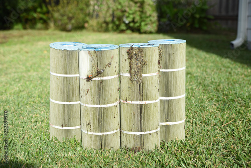 Dirty pool filters removed from swimming pool to clean