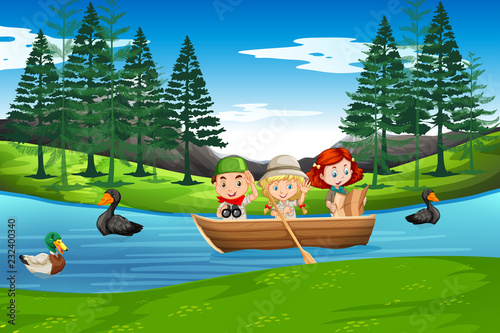 Children paddle on wooden boat © blueringmedia