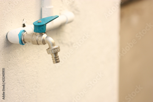 blue cap pipe on the wall