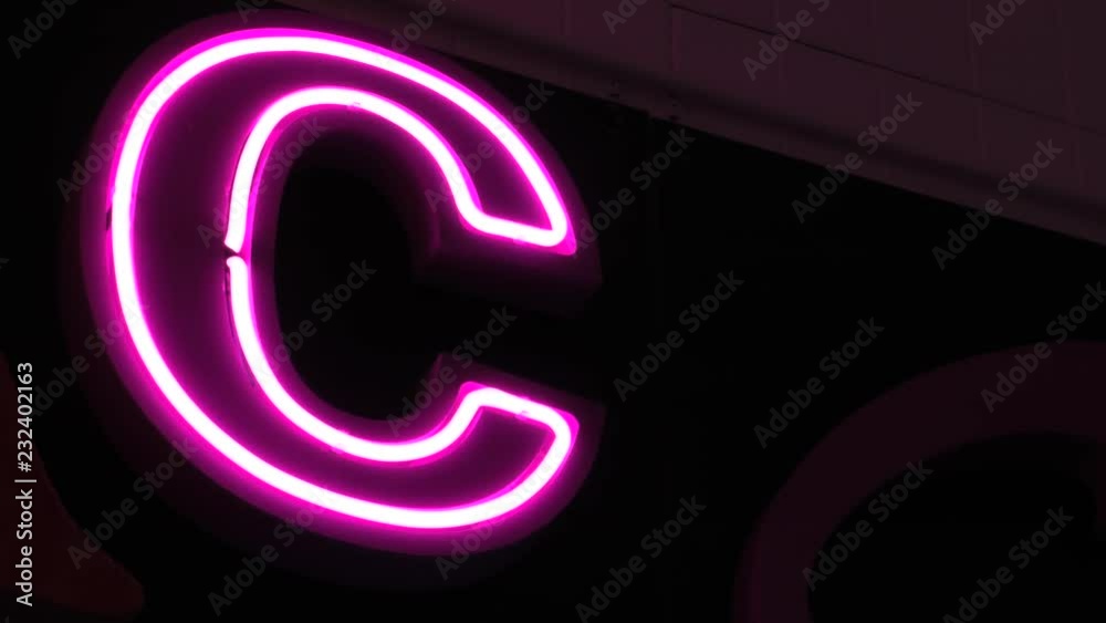 Neon lamp on the wall. 4K, UHD, 50p, Cinematic,Close-up, Neon lamp on the wall. 4K, UHD, 50p, Cinematic,Close-up,