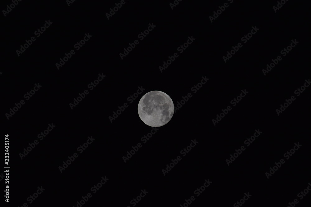 The moon in the night sky. Two thirds of the moon. The moon in the night sky. Two thirds of the moon.
