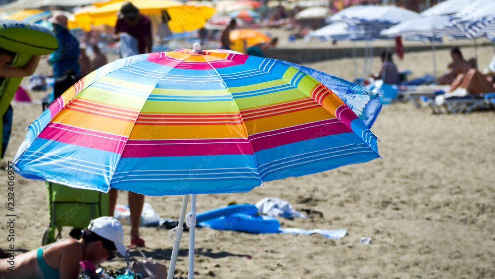 Bright and colourful beach umbrella Bright and colourful beach umbrella