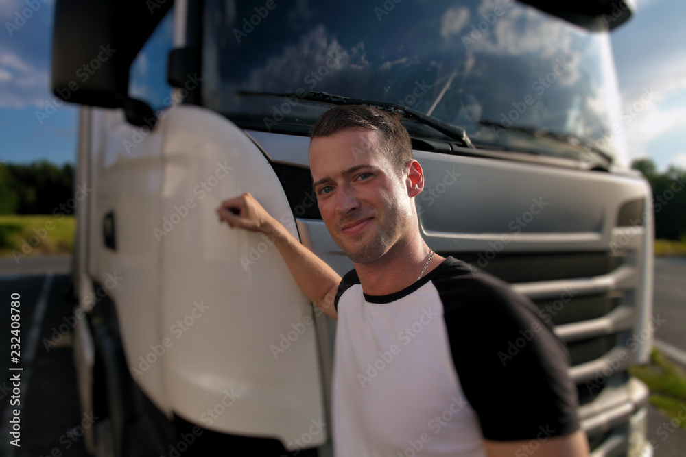 Truck driver on the road with trucks - obrazy, fototapety, plakaty 