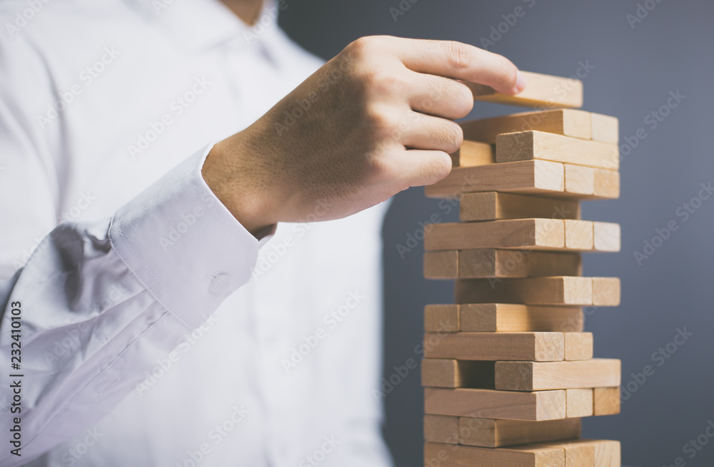 Businessman Building Up Tower Challenge In Business Businessman Building Up Tower Challenge In Business