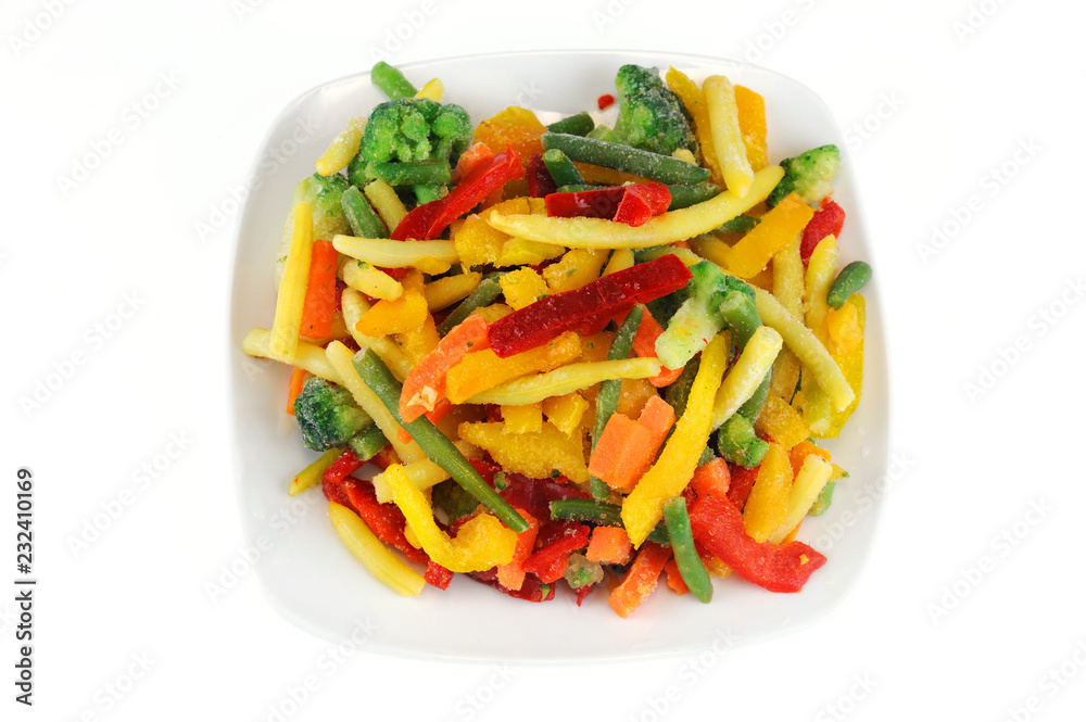 colorful frozen vegetable in the plate isolated on white background