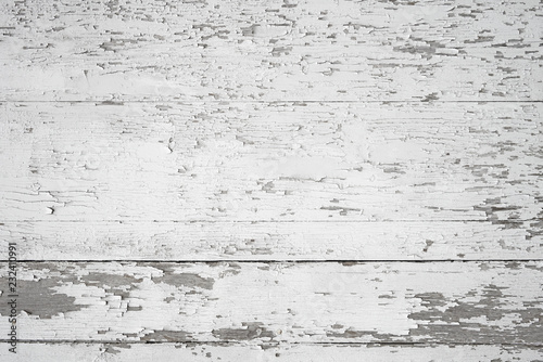 Old painted weathered wood textured background with long boards lined up. Wooden planks on a wall or floor with grain and rough vintage texture. Light neutral flat faded and washed out tones.