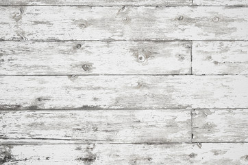 Old painted weathered wood textured background with long boards lined up. Wooden planks on a wall or floor with grain and rough vintage texture. Light neutral flat faded and washed out tones.