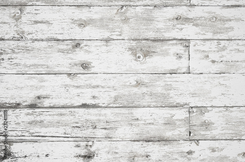 Old painted weathered wood textured background with long boards lined up. Wooden planks on a wall or floor with grain and rough vintage texture. Light neutral flat faded and washed out tones.