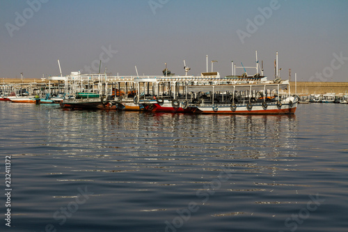 Tour boats docked on the Lake Nasser side of the Aswan High Dam in Egypt