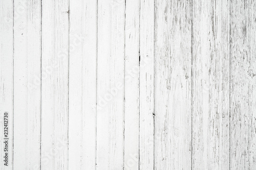 Old weathered wood surface with long vertical boards. Wooden planks on a wall or floor with grain and texture. Light neutral flat faded tones.