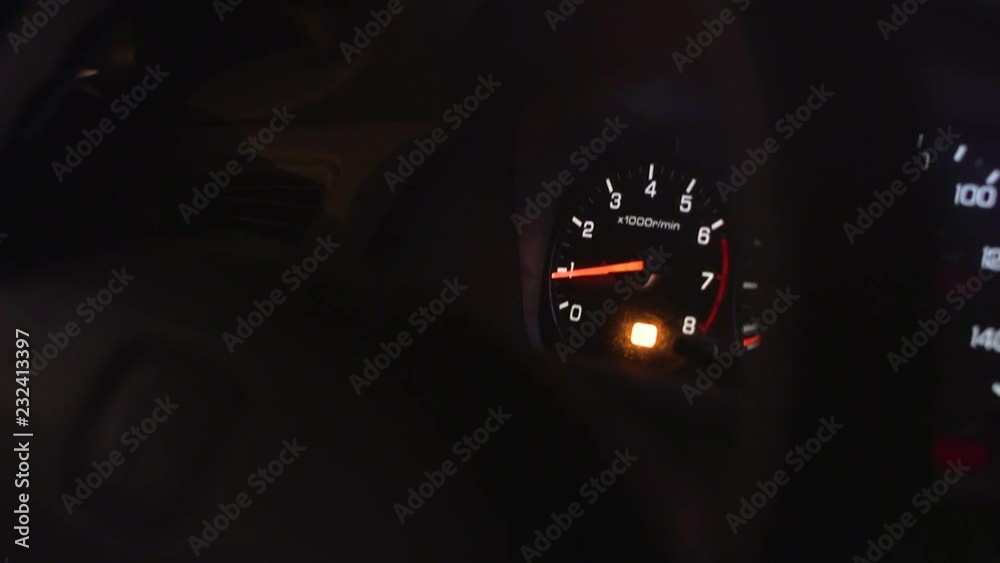 RPM Gauge car engine reving low RPMs through steering wheel Stock ビデオ