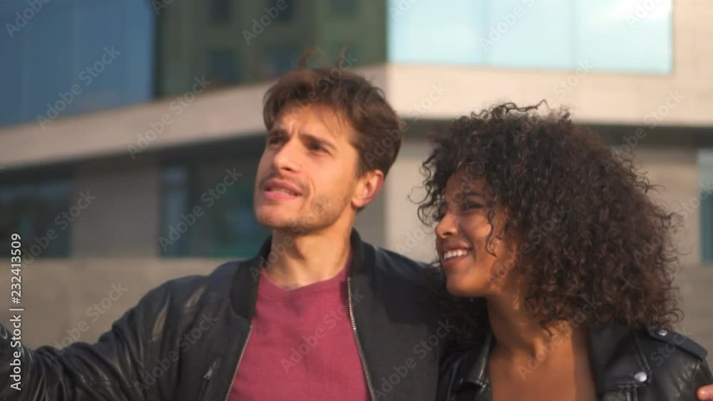 Happy couple walking outdoors in city Happy couple walking outdoors in city