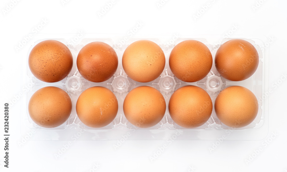 Chicken eggs in plastic package on white background. Chicken eggs in plastic package on white background.