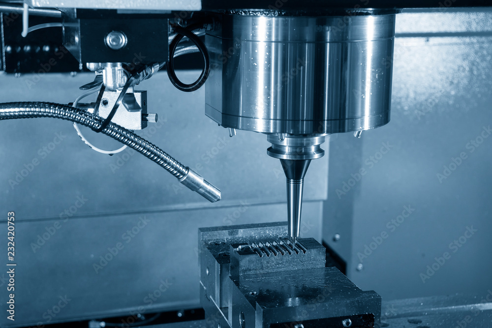 The CNC milling machine cutting the injection mold part by solid ball end mill tool.Mold manufacturing process. The CNC milling machine cutting the injection mold part by solid ball end mill tool.Mold manufacturing process.