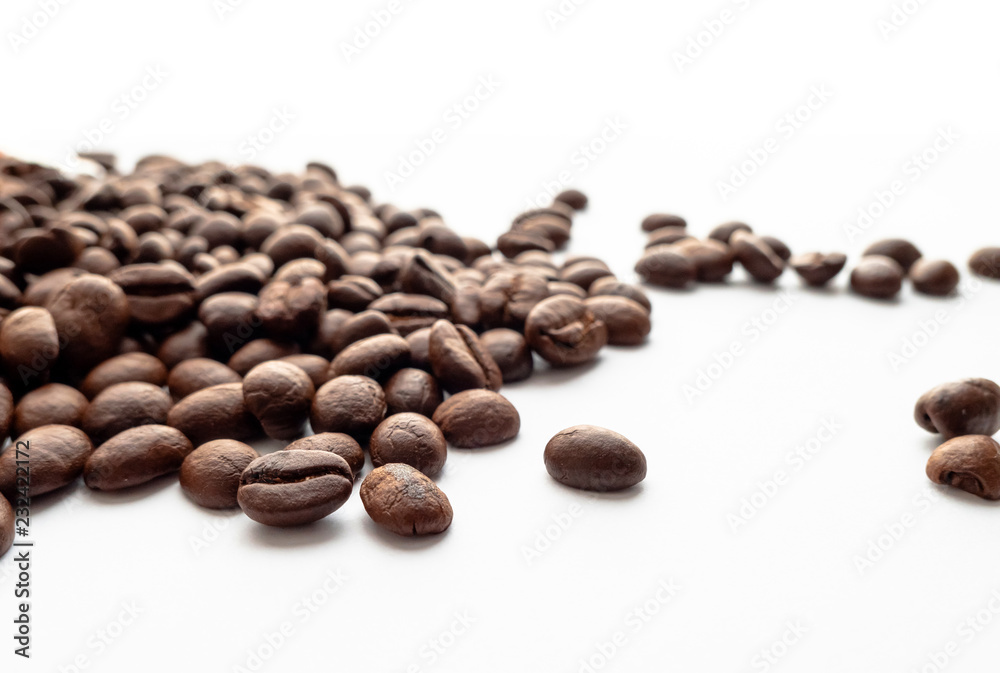 Roasted coffee beans on white background. Roasted coffee beans on white background.