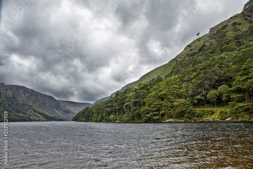 Dramatic landscape from the heart of Glendalough valley Irish Scenery. Blue sky. Wicklow National Park  Ireland