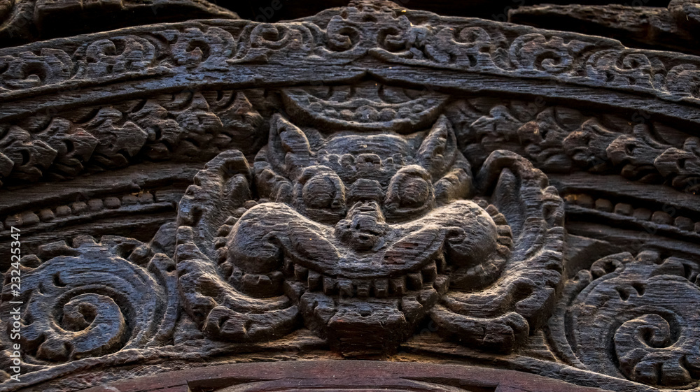 Wood carvings of Hindu Gods on the temple in Bhaktapur Durbar Square