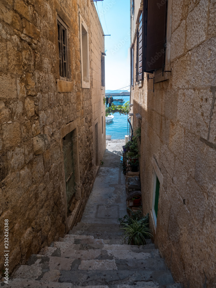 Passage to the sea between stone houses