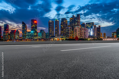 City skyscrapers and road asphalt pavement photo
