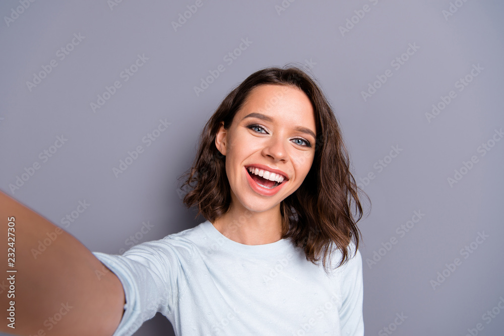 Lady blogger with her brunette hair she take picture on cellular Lady blogger with her brunette hair she take picture on cellular