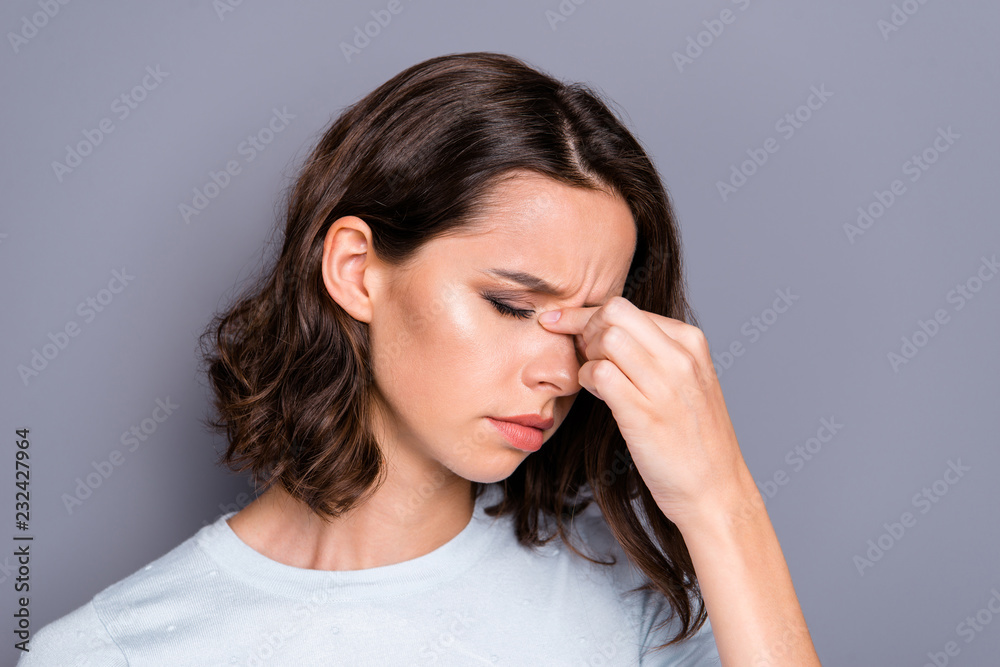 Half turn close up portrait of frustration grumpy lady with her Half turn close up portrait of frustration grumpy lady with her