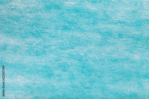 Light blue background of felt fabric. Texture of woolen textile