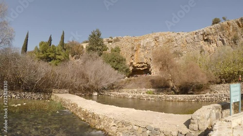 Tourists visit archaeological site of cave of Greek god pan, in Hermon Stream Nature Reserve, also known as Banyas, Golan, Israel